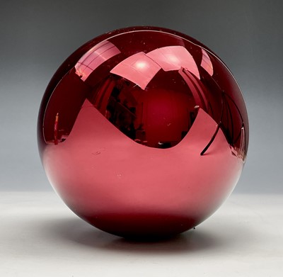 Lot 351 - A 20th century red glass witch ball. Maximum...