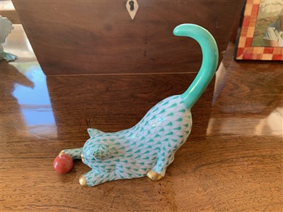 Lot 230 - A Herend porcelain cat with a ball.