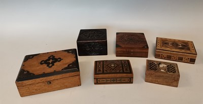 Lot 66 - Six Indian carved and inlaid wooden boxes.