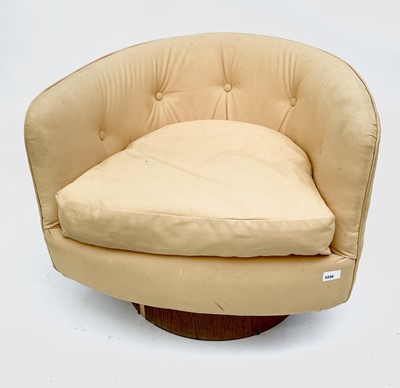 Lot 3172 - A stylish upholstered swivel armchair, with...
