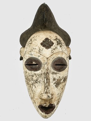 Lot 304 - An African tribal carved and painted wood mask....