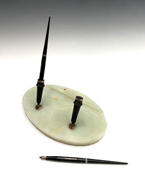 Lot 194 - An early 20th century onyx double pen stand...
