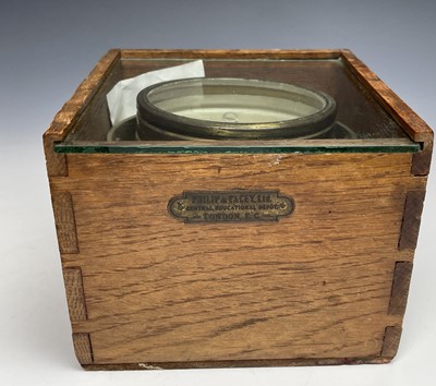 Lot 433 - A gimbal compass, in an oak case with glazed...