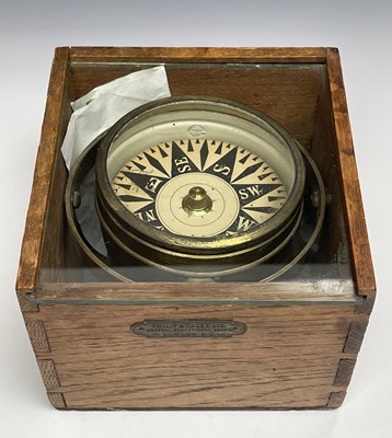 Lot 433 - A gimbal compass, in an oak case with glazed...