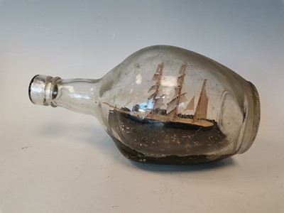 Lot 24 - A vintage ship in a bottle.