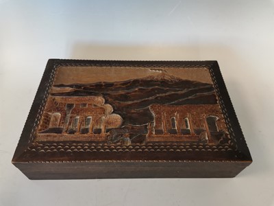Lot 25 - A carved wooden box depicting a landscape...