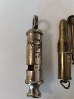 Lot 29 - A brass trench art cigarette lighter, an Acme...