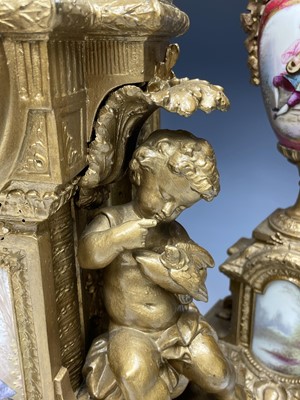 Lot 2932 - A 19th century gilt metal and porcelain three...