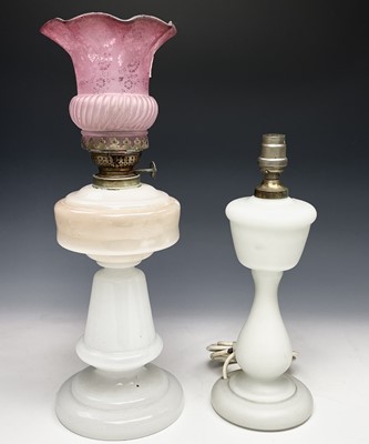 Lot 443 - Two white opaque glass oil lamps, one...