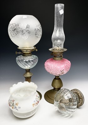 Lot 444 - Three oil lamps with glass reservoirs, two...