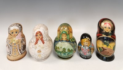 Lot 30 - Five sets of hand painted Russian nesting dolls.
