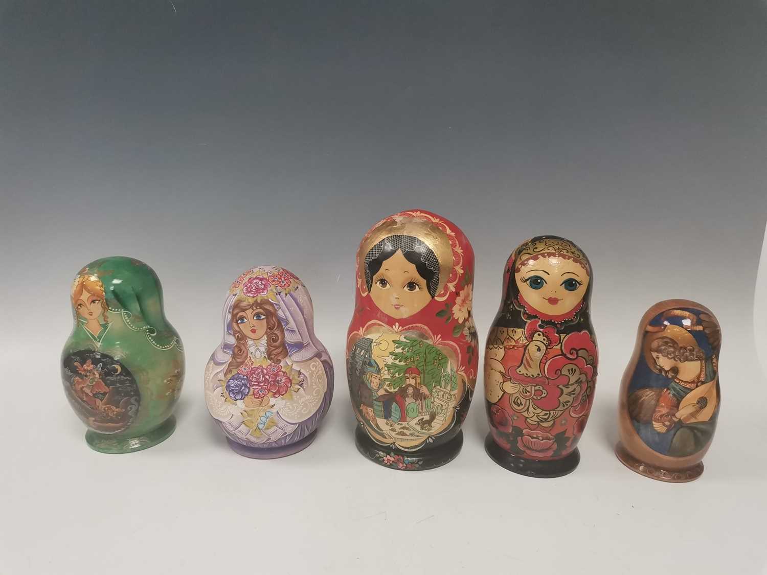 Lot 31 - Five sets of hand painted Russian nesting dolls.