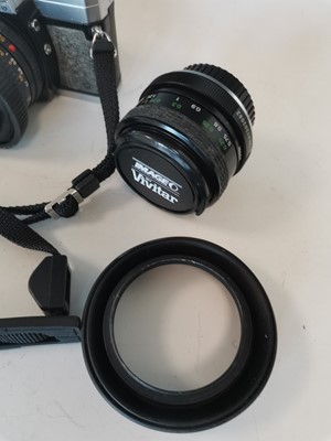 Lot 8 - A Minolta X 300 camera with two Vivitar lenses...