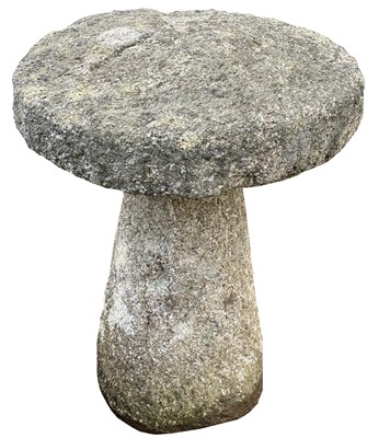 Lot 611 - A granite staddle stone of typical form....