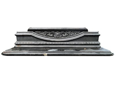 Lot 614 - A Victorian-style cast iron fire surround in...