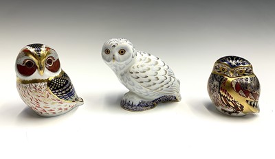 Lot 1151 - Three Royal Crown Derby owl paperweights,...