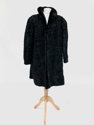 Lot 2859 - A 1960's ladies astrakhan fur coat, size small;...