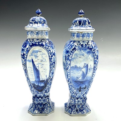 Lot 209 - A pair of Dutch Delft pottery vases and covers,...