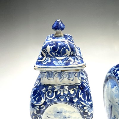 Lot 209 - A pair of Dutch Delft pottery vases and covers,...