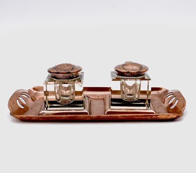 Lot 101 - An Aesthetic Movement copper inkstand, circa...
