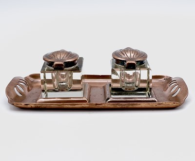 Lot 101 - An Aesthetic Movement copper inkstand, circa...