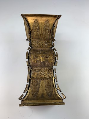 Lot 69 - A Chinese gilt bronze Gu-shaped vase, long...