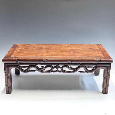 Lot 5 - A Chinese hardwood Kang table, with a pierced...