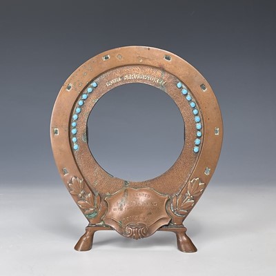 Lot 180 - An early 20th century copper frame in the form...