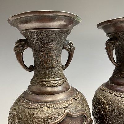 Lot 12 - A pair of Japanese bronze twin-handled vases,...