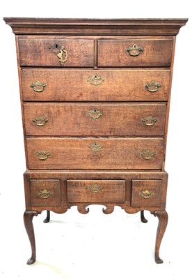 Lot 14 - A George III oak chest on stand, with two...