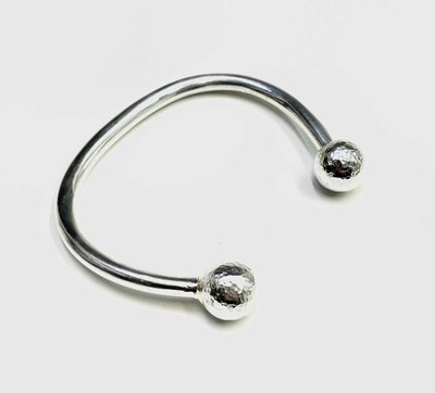 Lot 814 - A contemporary high purity silver heavy bangle...