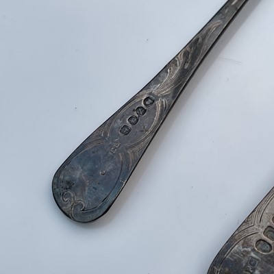Lot 9 - Four George III silver berry spoons, each with...