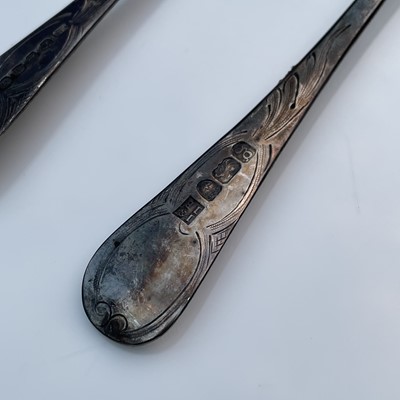 Lot 9 - Four George III silver berry spoons, each with...