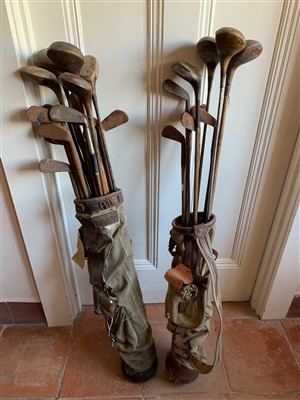 Lot 73 - A collection of old golf clubs, including...