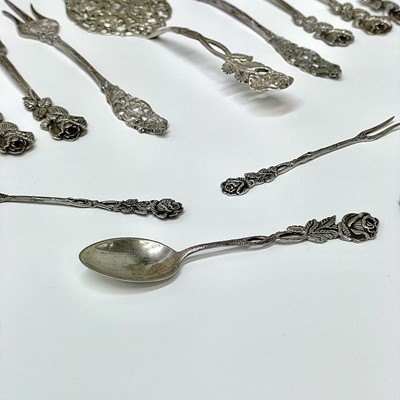 Lot 14 - A collection of white metal cutlery with cast...