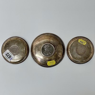 Lot 17 - A pair of silver pin trays, each set with an...