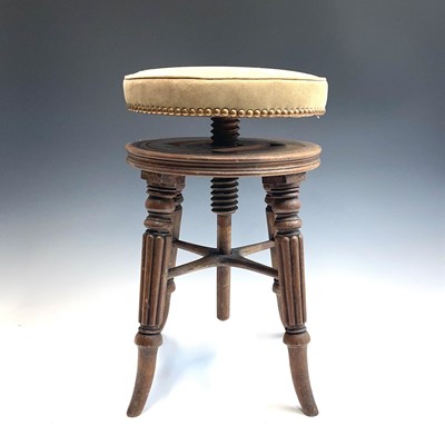 Lot 3050 - A Regency mahogany circular piano stool, with...