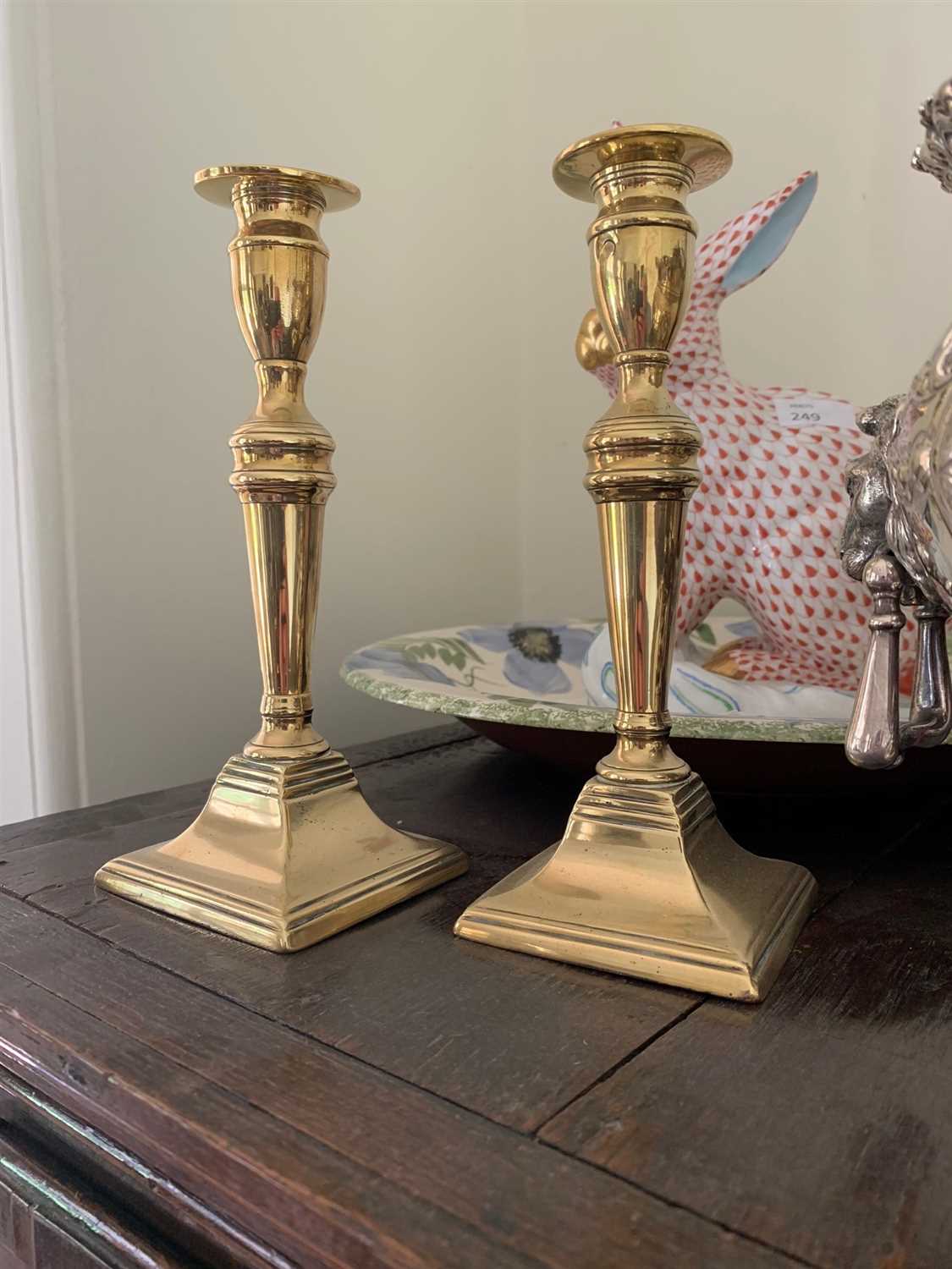 Lot 16 - A pair of Georgian brass candlesticks.