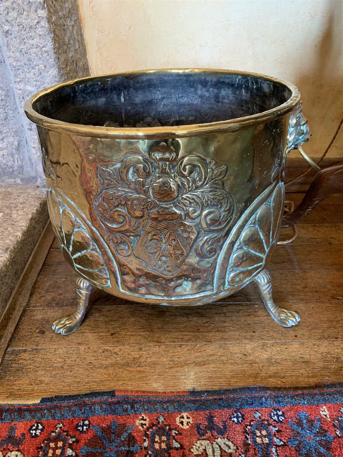 Lot 35 - A 19th century brass log bin, with lion's mask...