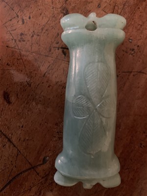 Lot 254 - A carved jade toggle.