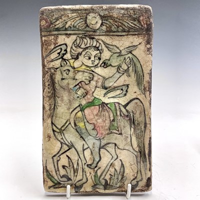 Lot 1006 - A Persian tin glazed pottery tile, 19th...