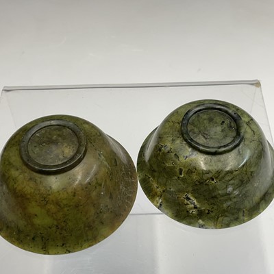 Lot 104 - Two Chinese spinach jadeite bowls, early 20th...