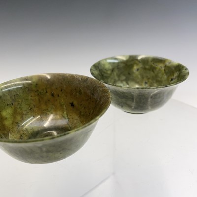 Lot 104 - Two Chinese spinach jadeite bowls, early 20th...