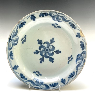 Lot 180 - A London Delft pancake plate, circa 1720, with...