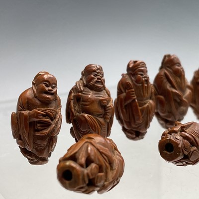 Lot 122 - Eight Chinese carved coquilla nuts, each in...
