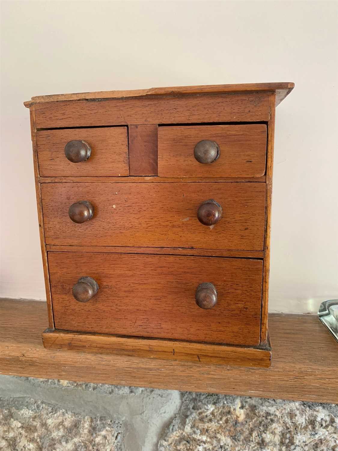 Lot 17 - A miniature mahogany chest of drawers.