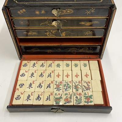 Lot 97 - A Chinese mahjong set in lacquered chinoiserie...