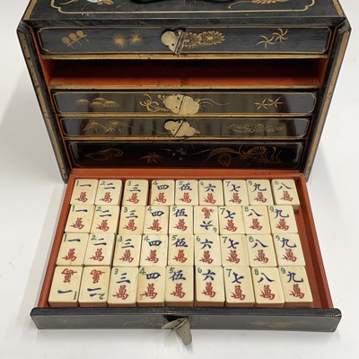 Lot 97 - A Chinese mahjong set in lacquered chinoiserie...