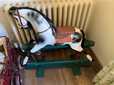 Lot 344 - A 20th century carved wood rocking horse.