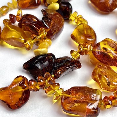 Lot 715 - A raw amber bead necklace, with irregular...